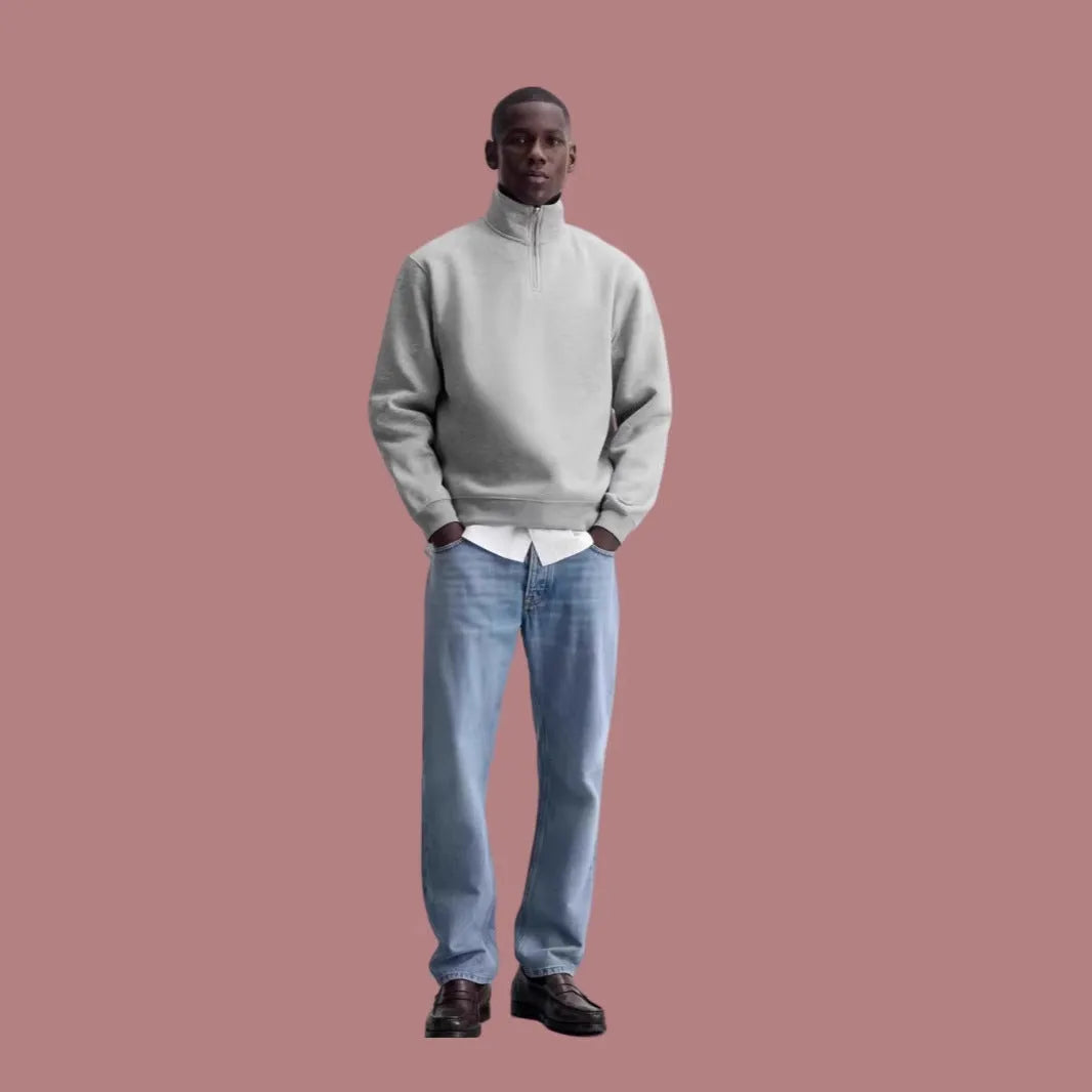 Grey half-zip cotton hoodie with a stand collar, shown on a model.