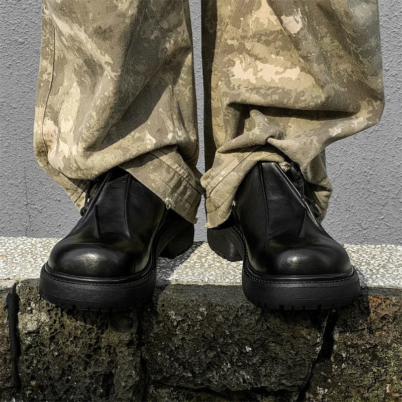 Black platform warped head leather shoes with a low top microfiber upper and rubber sole.