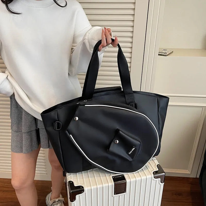 Black one-shoulder yoga storage bag showing large capacity and casual design