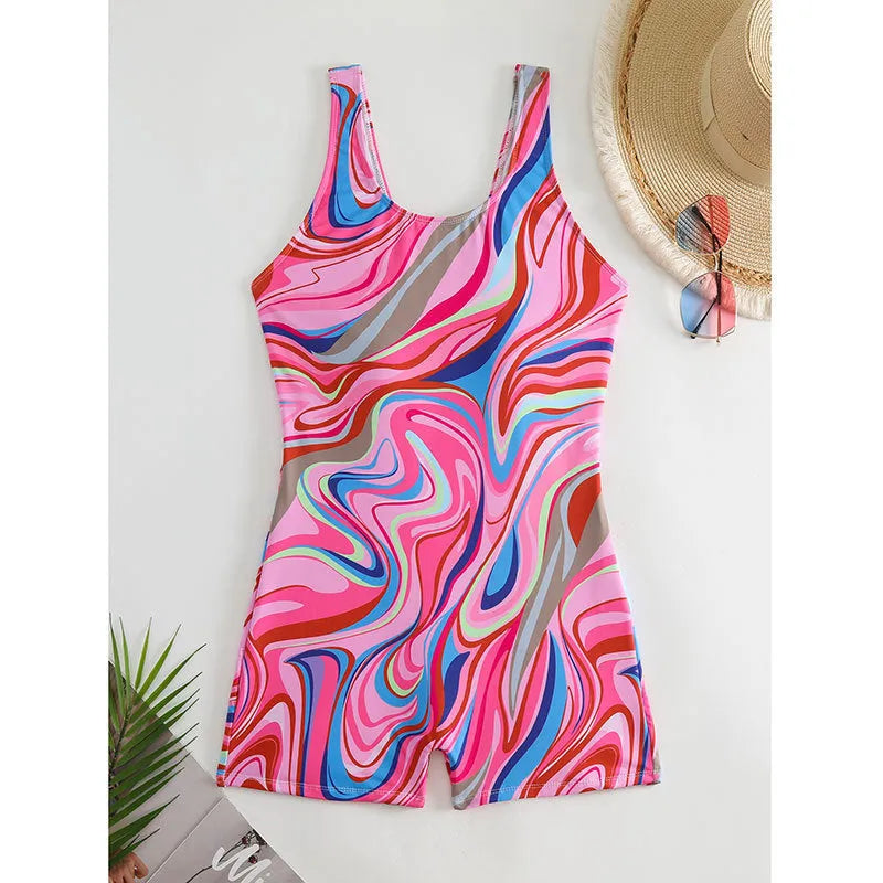 A woman's printed one-piece swimsuit with a high waist and backless design.