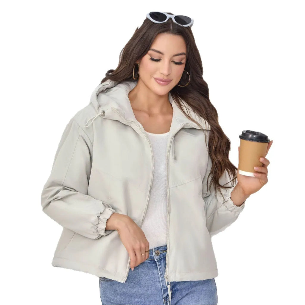 Women's grey loose-fit hooded polyester jacket with full zip and long sleeves.