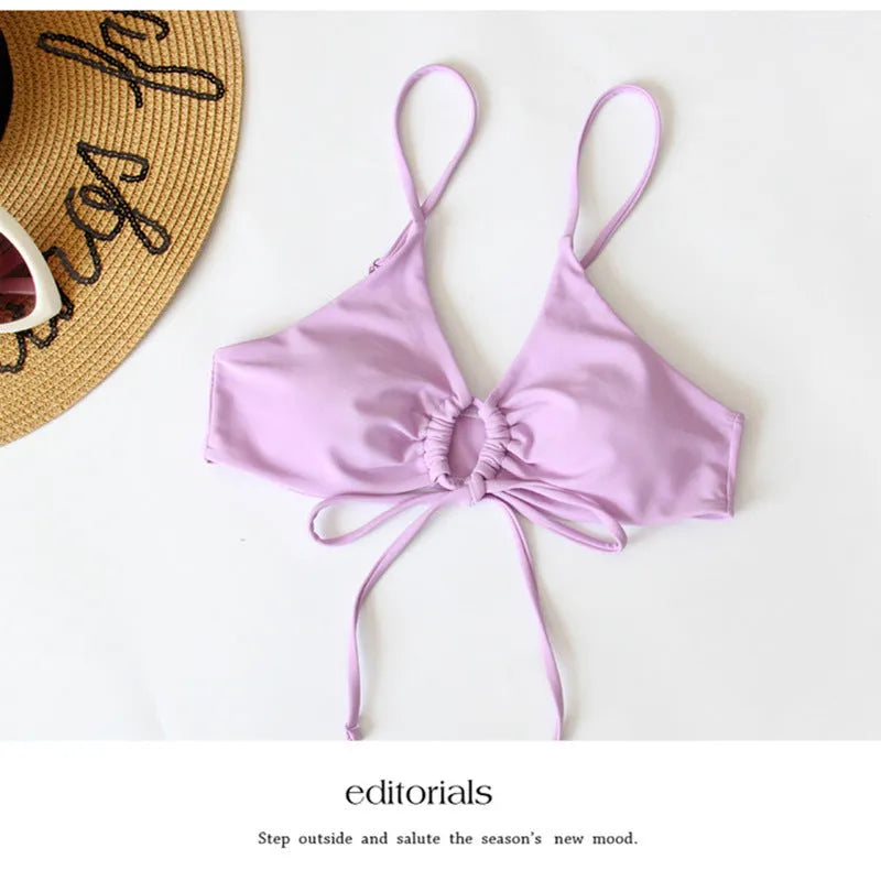 Women's orange tied bow split front bikini with briefs bottoms, shown on a mannequin.