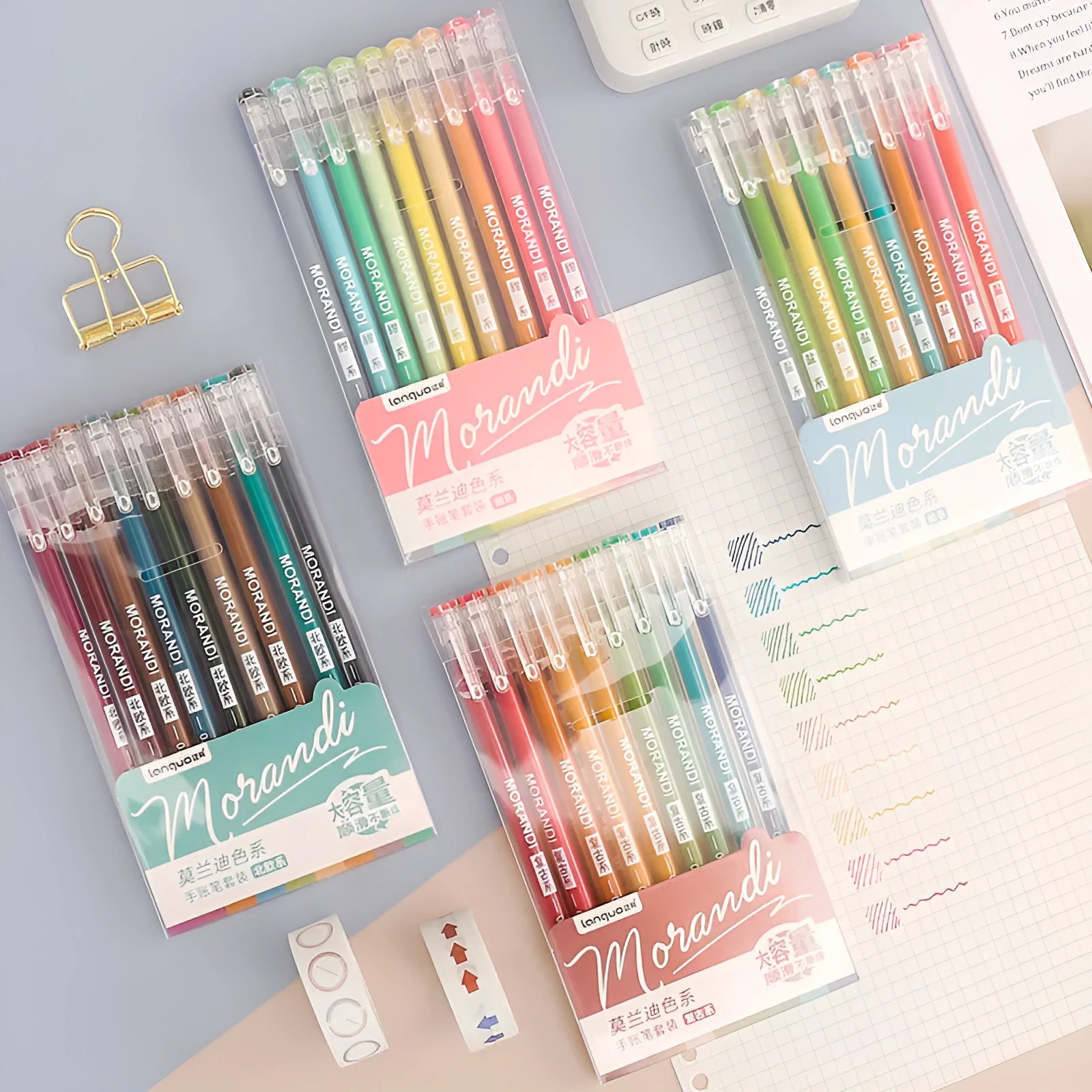 Set of nine colourful 0.5mm needle-tip gel pens with plastic shells arranged in a box.