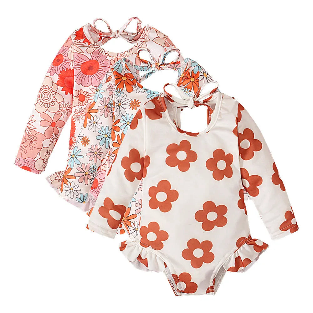 Girl's white floral print open back swimsuit with crew neck design and high-cut briefs