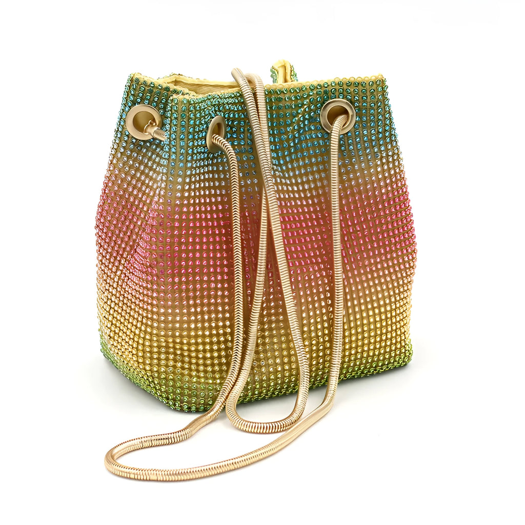 Rainbow coloured soft bucket handbag covered entirely in sparkling rhinestones with a top handle.