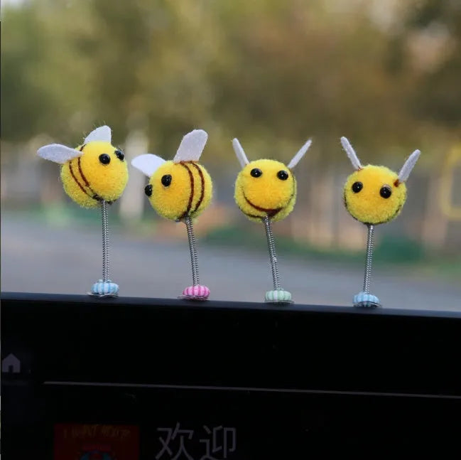Swing Spring Bee car decoration with fur ball material and cartoon design measuring 3x3 cm