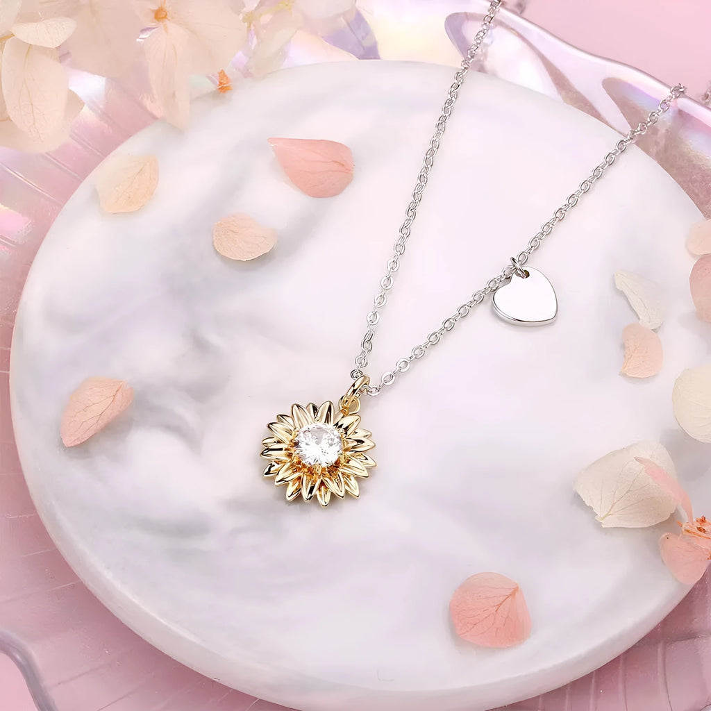 Adjustable 925 silver sunflower necklace with daisy-petal pendant on a cross chain.