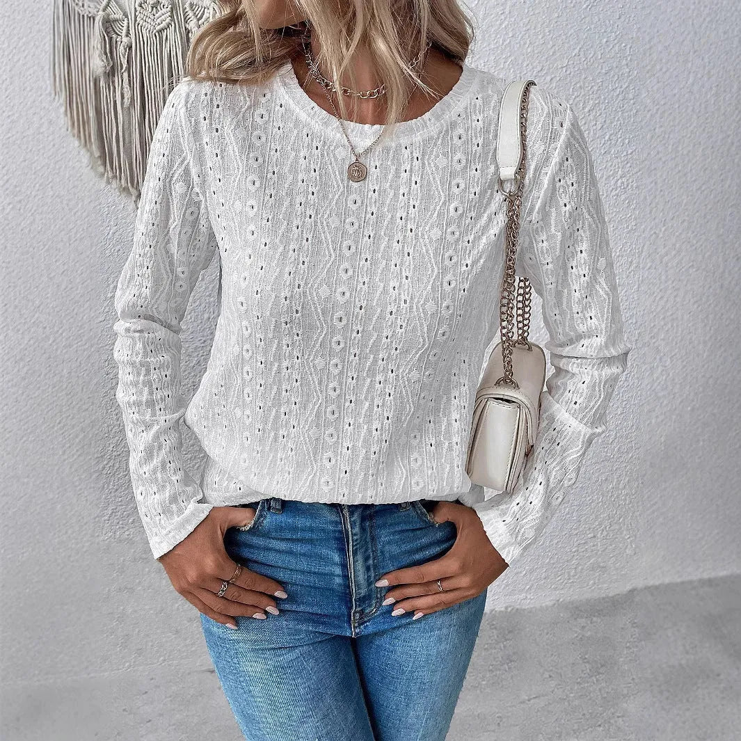 White loose fit women's long sleeve round neck t-shirt laid flat
