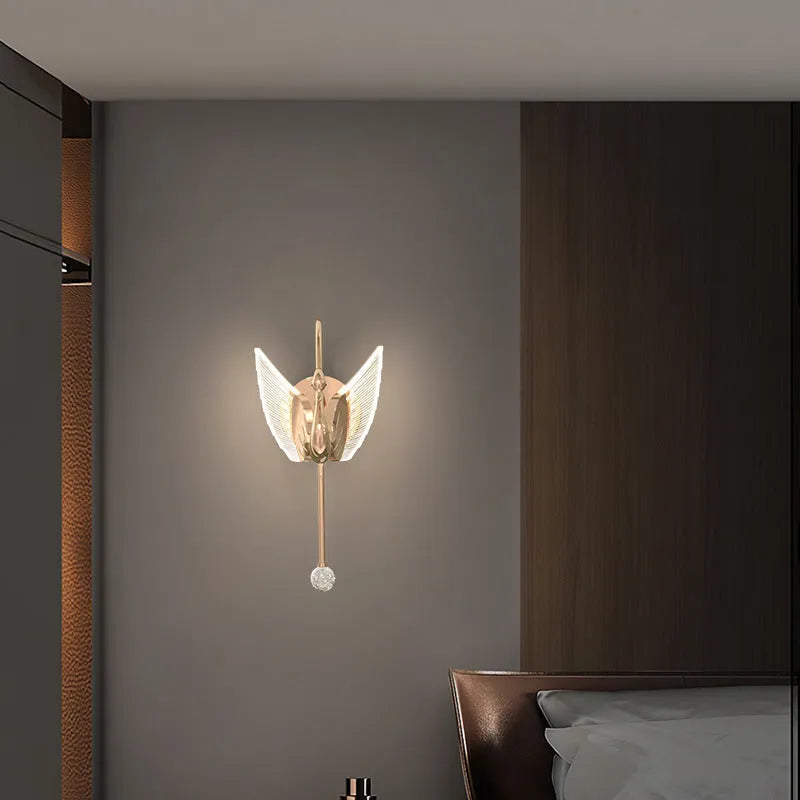Modern gold swan-shaped wall lamp with acrylic shade and dimmable LED light.