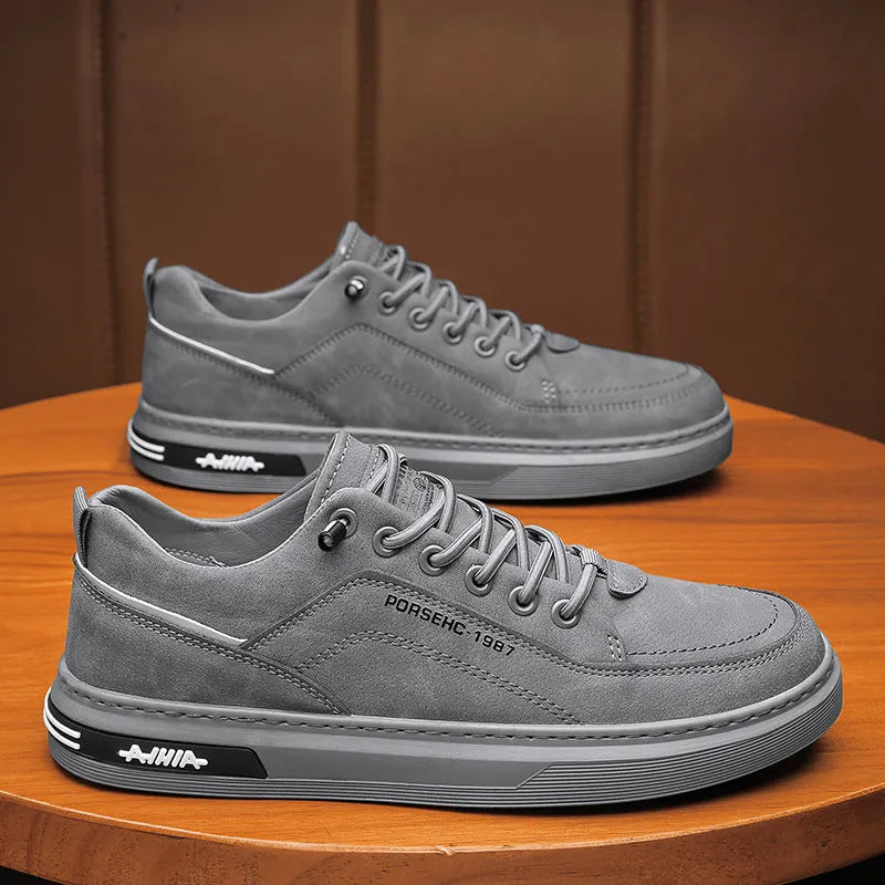 Men's khaki low-top casual shoes with round toe and flat rubber sole for work.