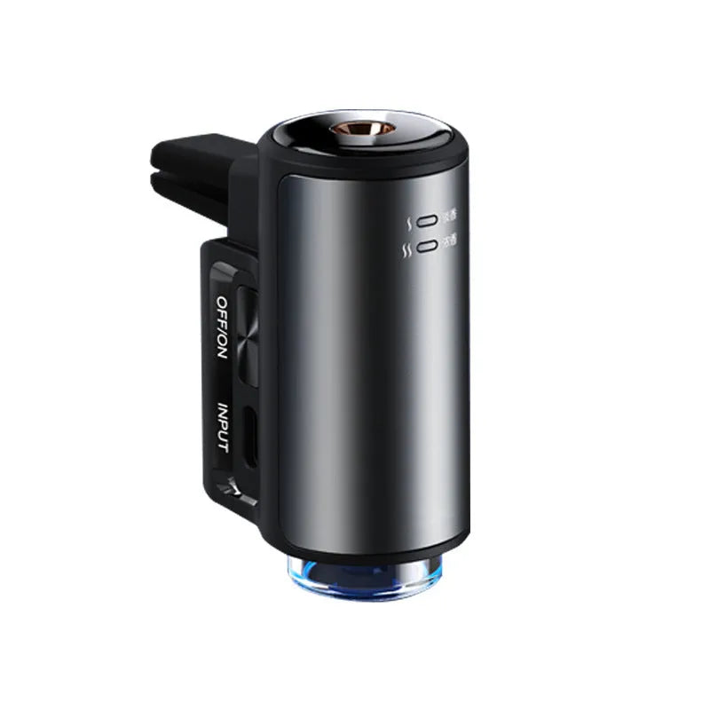 Obsidian black car aroma diffuser clipped to vehicle air vent with essential oil bottles