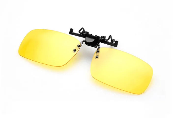 Clip-on sunglasses with polarised PC lenses attached to prescription glasses for driving