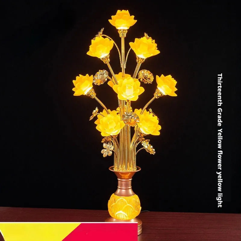 Coloured glaze pink and yellow LED lotus lantern for Buddha worship on an alloy stand.