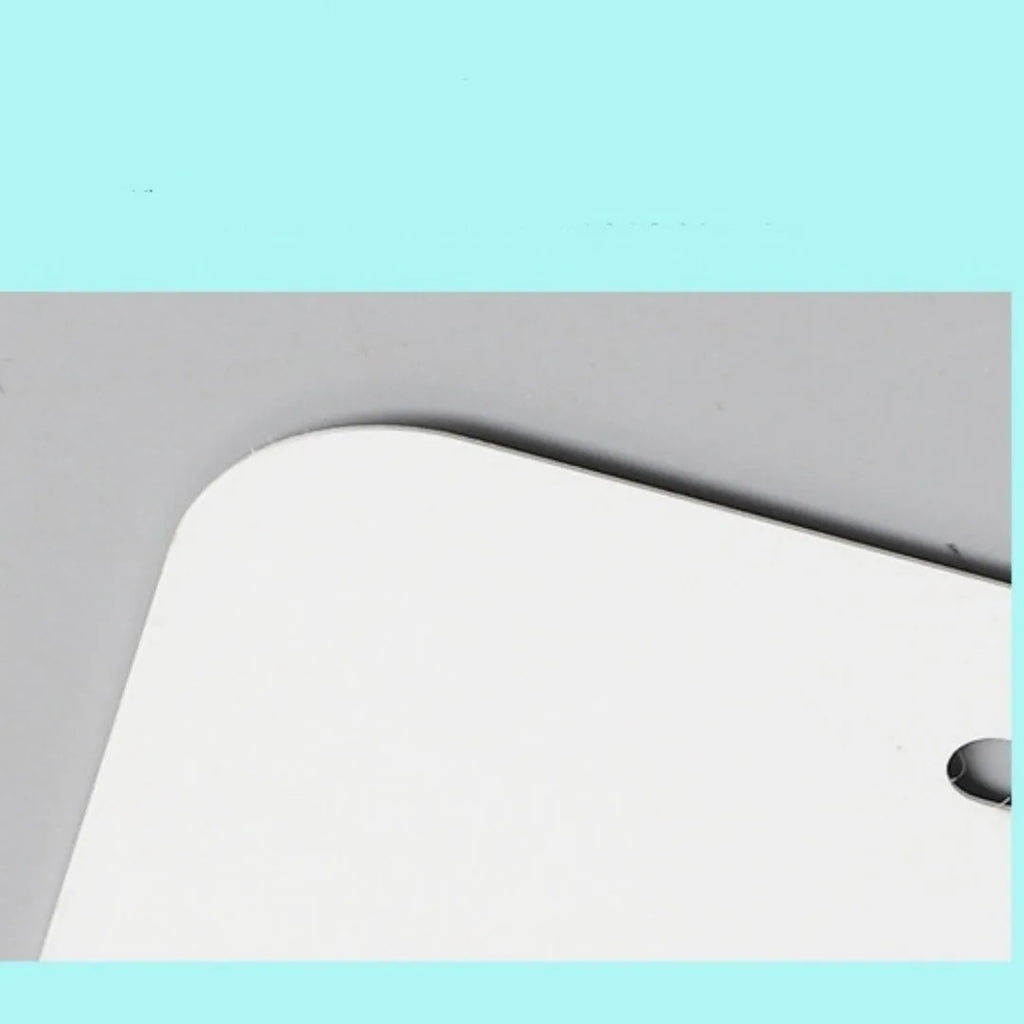 White aluminium car number plate blank measuring 30.3 by 15 centimetres.