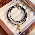 Women's blue sand stone bracelet with three gold-coloured rings in multi-layer design