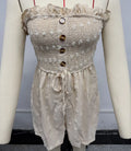 Women's blue sleeveless off-shoulder jumpsuit with button detailing and mid waist design
