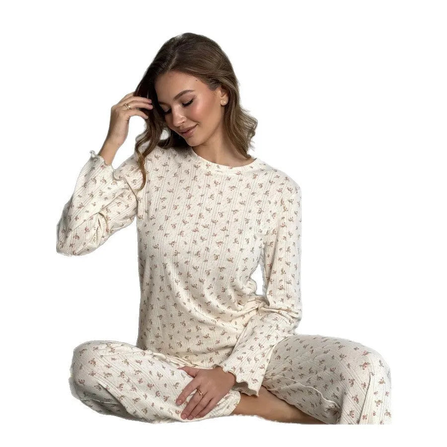 White floral print women's co-ord suit with bell sleeve top and wide leg trousers