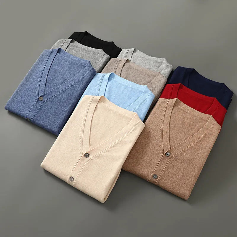 Man wearing a beige Andy velvet V-neck cardigan coat with long sleeves.