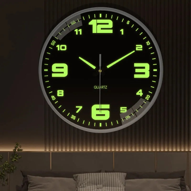 Modern 8 inch luminous wall clock in plastic case on a wall.
