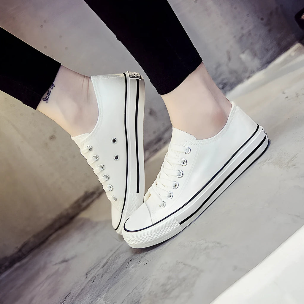 Women's solid-colour canvas shoes in black, white black, white red, or all black colour options