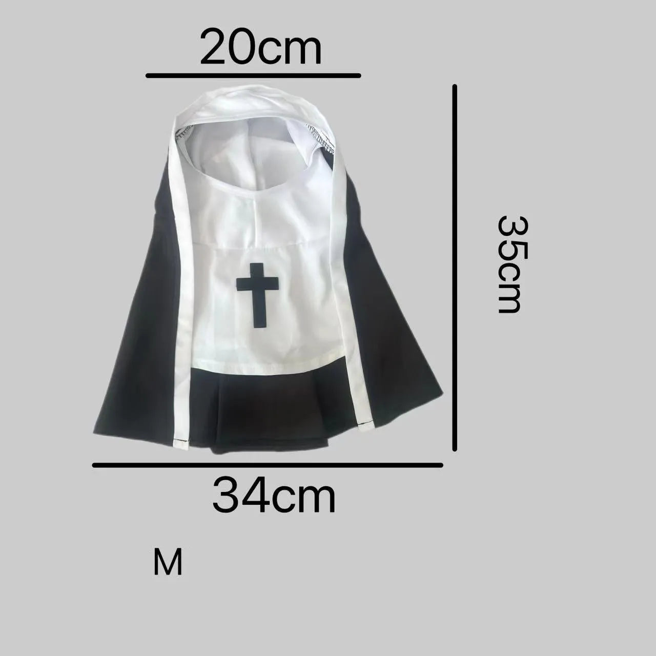 Black and white nun costume cloak on a small dog, showing the pullover design.