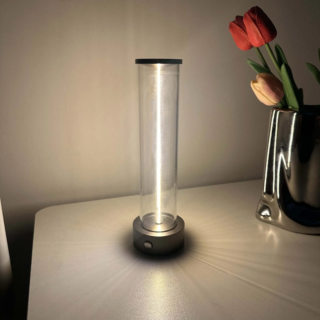 Slender glass LED light strip with magnetic base for USB charging night light.