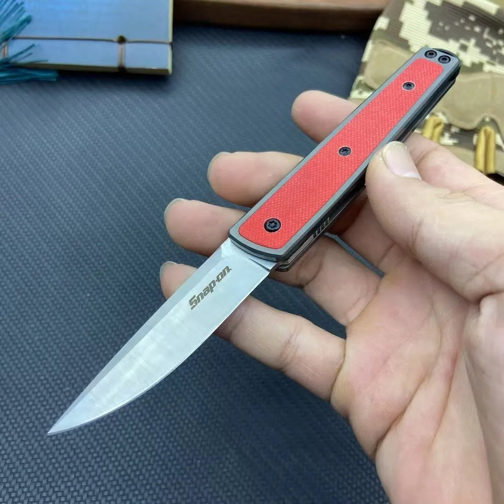 CRKT 7190 folding fruit knife with stainless steel blade in black, red, or coffee colour, showing closed and open positions