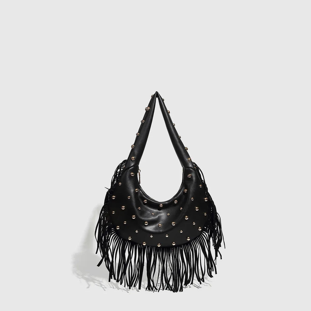 Retro-style black tassel shoulder handbag showing structured shape and decorative tassel.