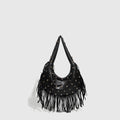 Retro-style black tassel shoulder handbag showing structured shape and decorative tassel.