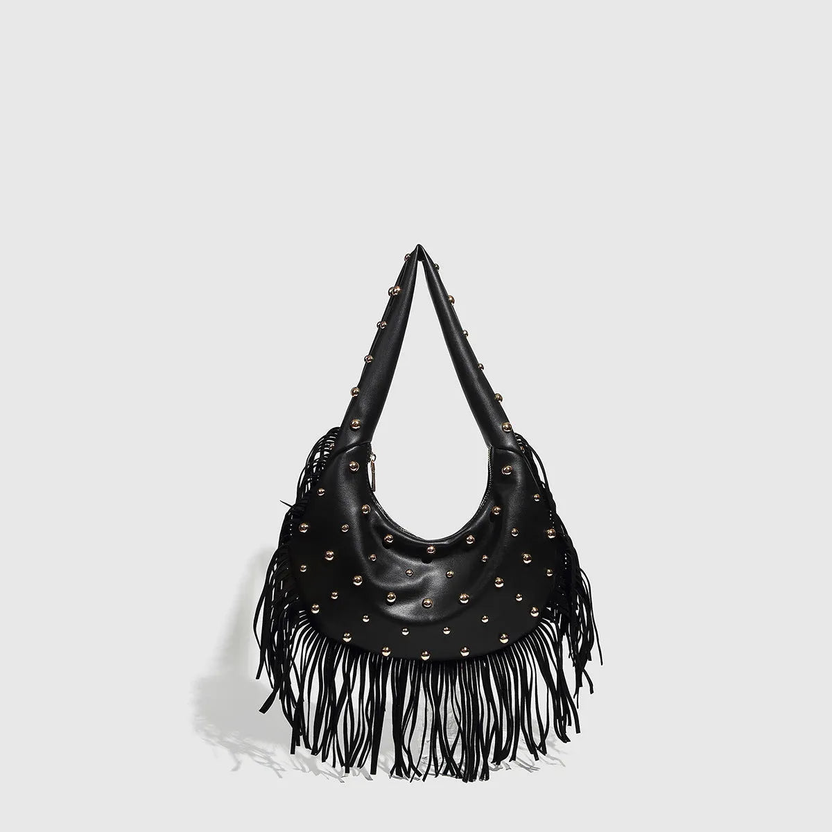 Retro-style black tassel shoulder handbag showing structured shape and decorative tassel.