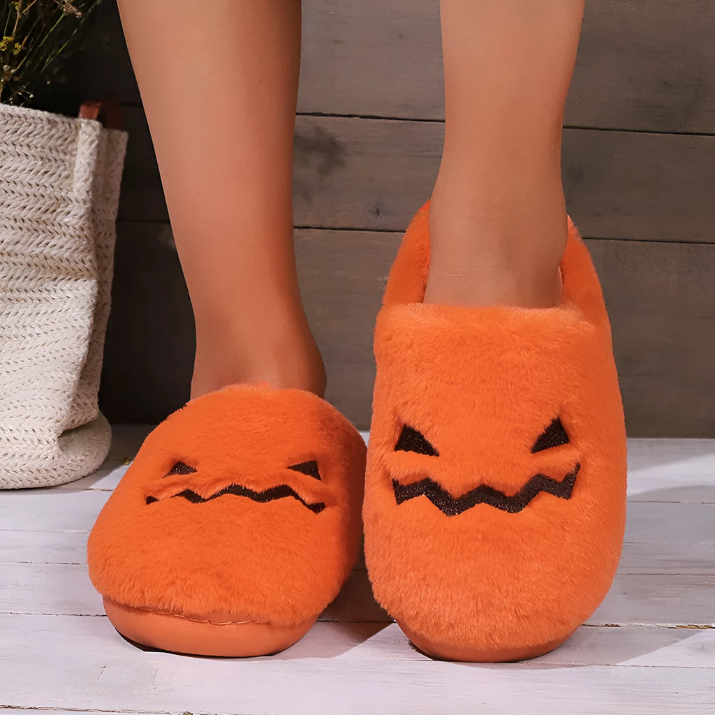 Orange coral velvet plush slippers with a non-slip PVC sole and fluffy lining.