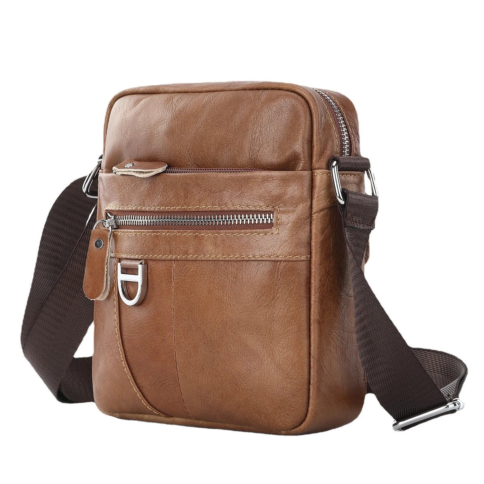 Retro brown leather messenger bag with crossbody strap on a table.