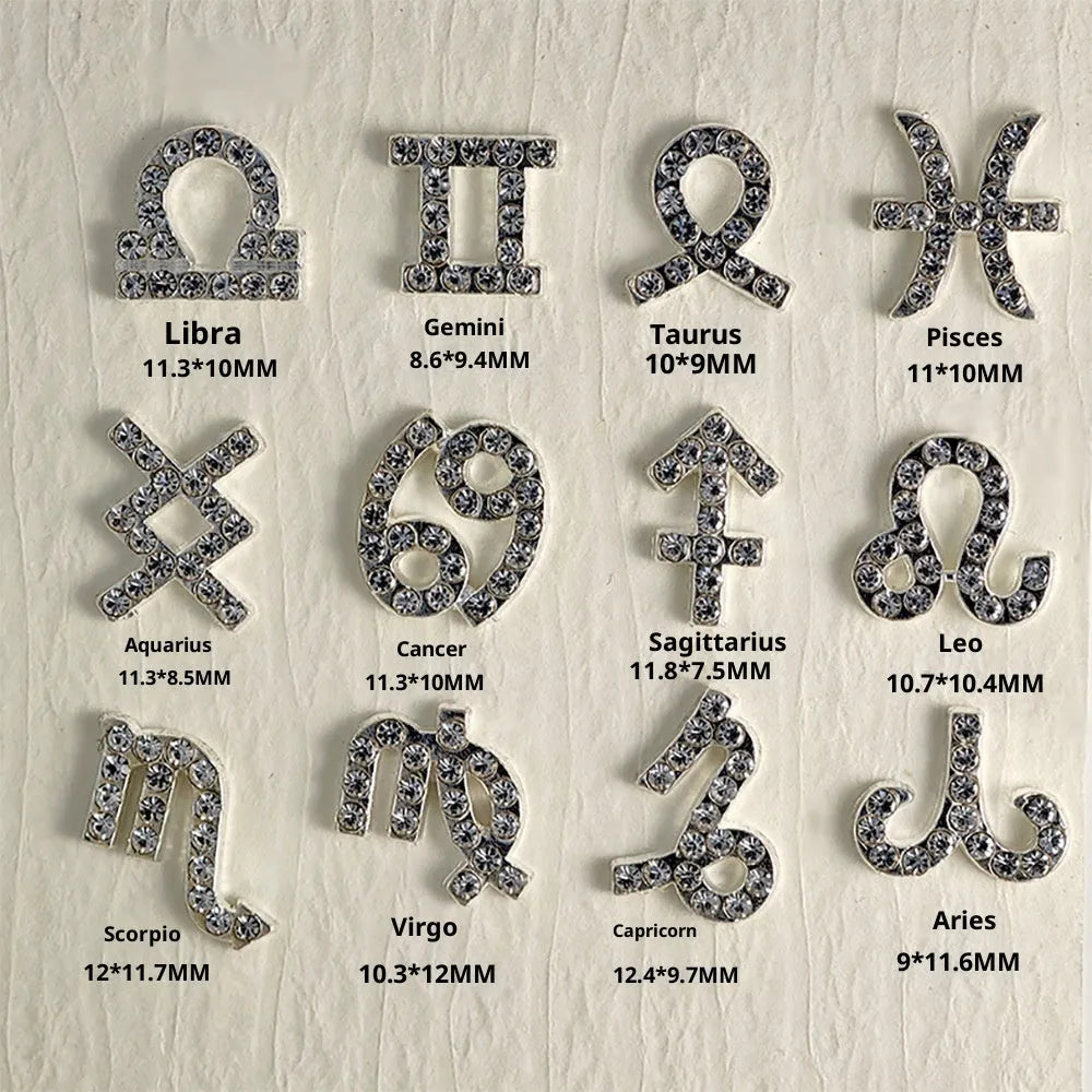 Twelve zodiac nail art accessories in alloy with diamond inlays, silver and gold finish, starry sky pattern.