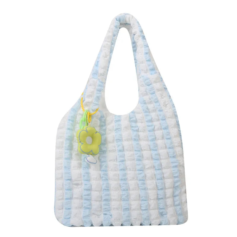 Women's pleated bubble shoulder bag with a floral pendant in soft polyester, shown in a vertical square shape.
