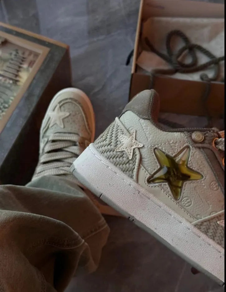Green low-top casual shoes with star pattern, mesh lining, and a thick rubber sole.