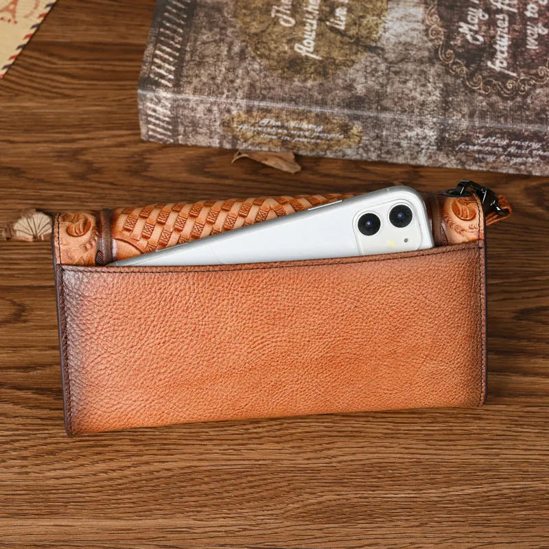 Retro brown women's tri-fold wallet with deep embossed floral pattern, shown open to reveal compartments.