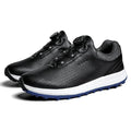 Men's white low top golf sneakers with breathable holes and a textured non-slip sole.
