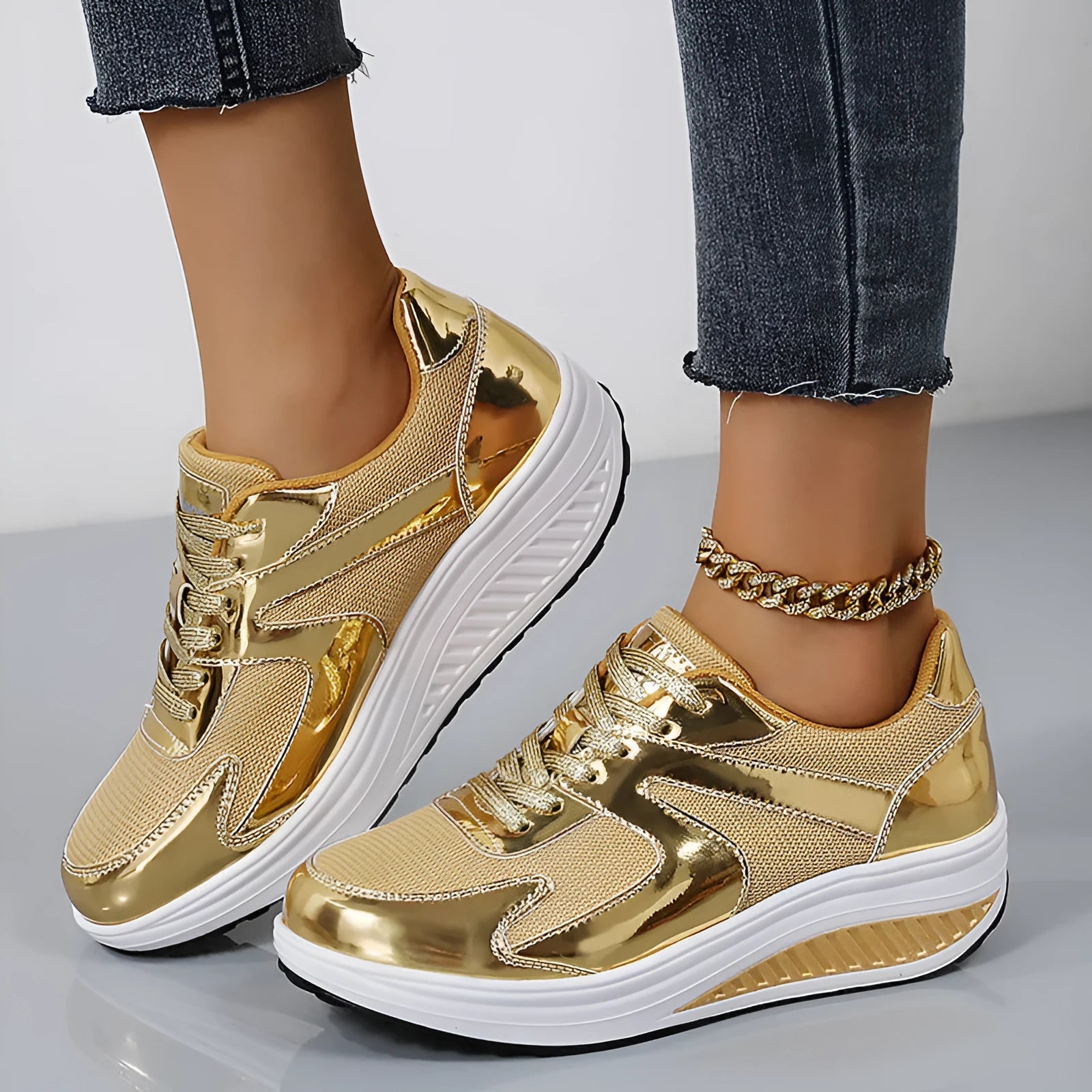 Women's gold mesh platform trainers with cross-strap design and waterproof thick sole