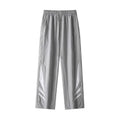 Men's straight leg trousers in black, showing button fly and elastic waistband on a hanger.