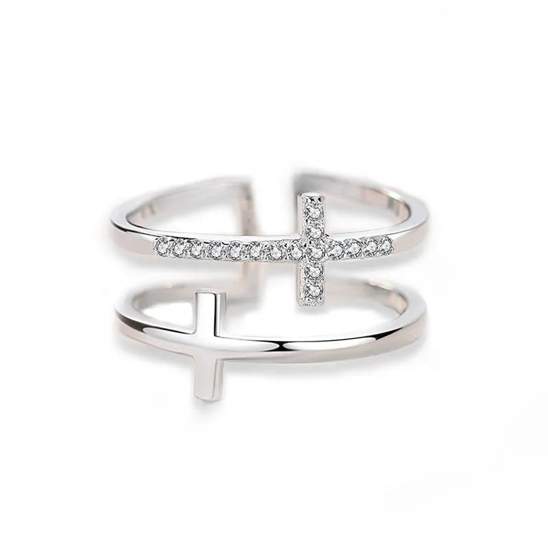 Double cross geometric women's ring with zircon stones on an adjustable copper band.