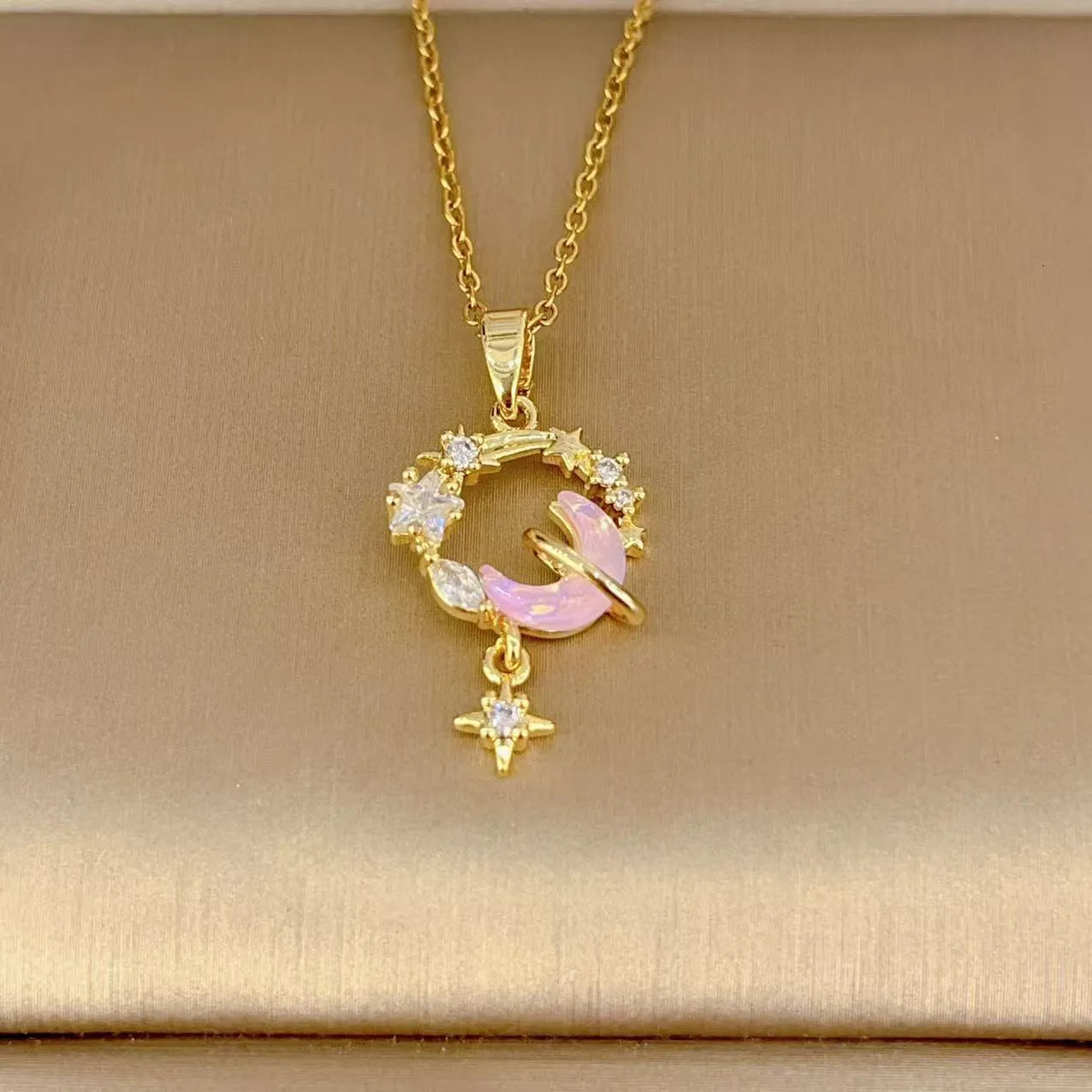 Gold electroplated copper necklace with micro-inlaid zirconium moon pendant on O-ring chain