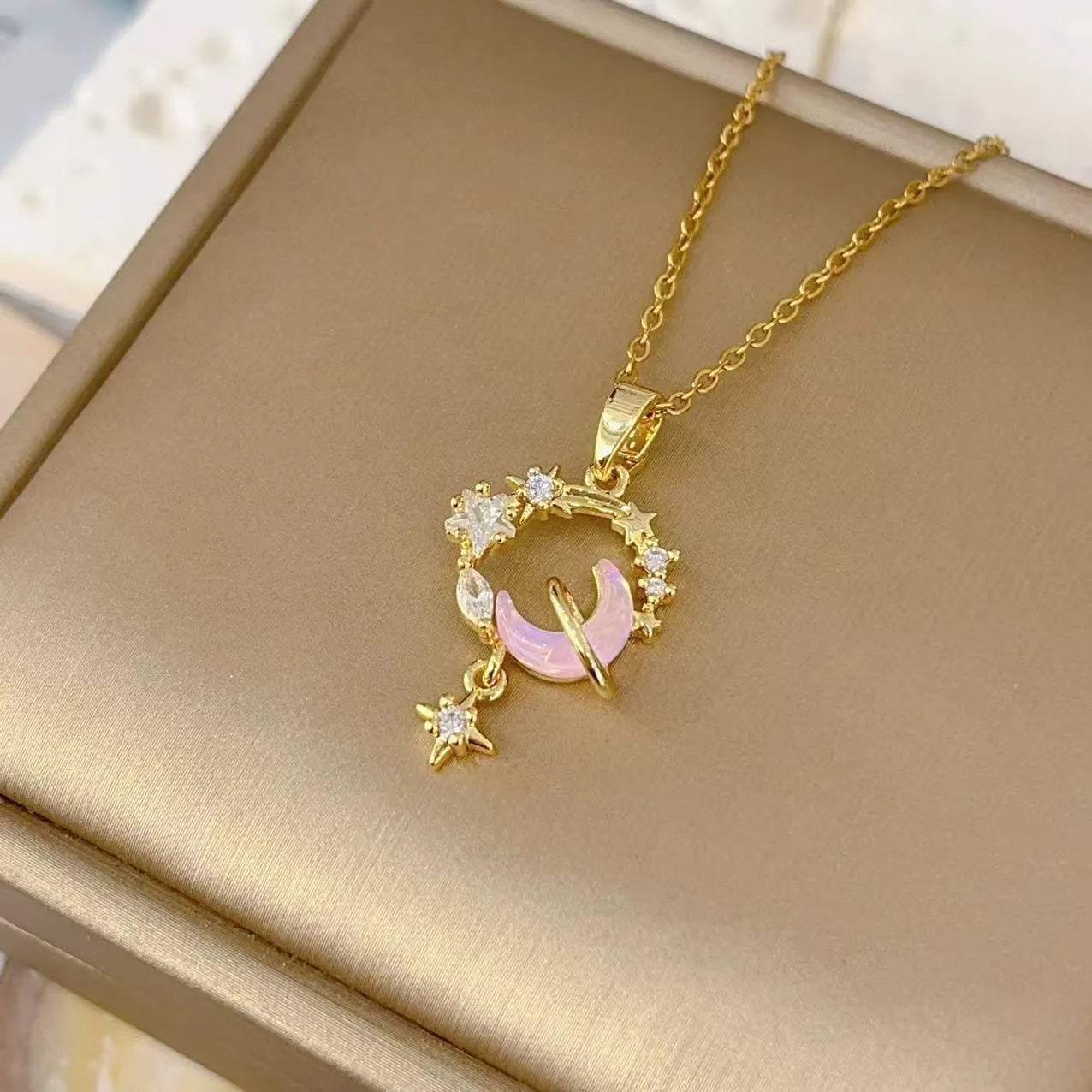 Gold electroplated copper necklace with micro-inlaid zirconium moon pendant on O-ring chain
