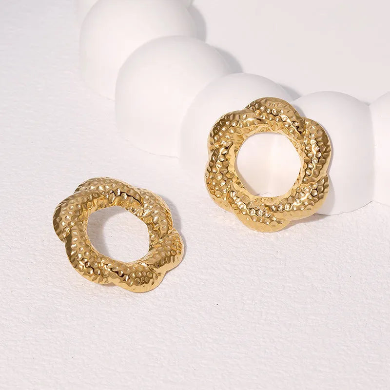 Stainless steel geometric round stud earrings in gold and steel colour, electroplated finish