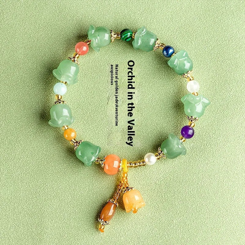 Carved natural Xinjiang Jinsi jade bracelet with aventurine orchid beads and Gobi jade topaz accents.