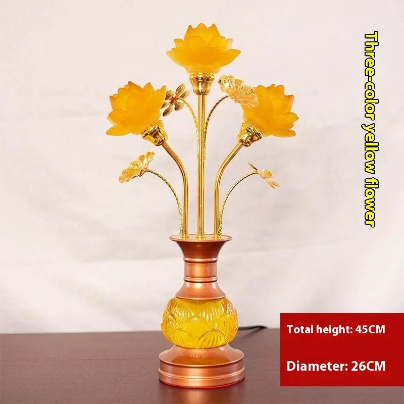 Coloured glaze pink and yellow LED lotus lantern for Buddha worship on an alloy stand.