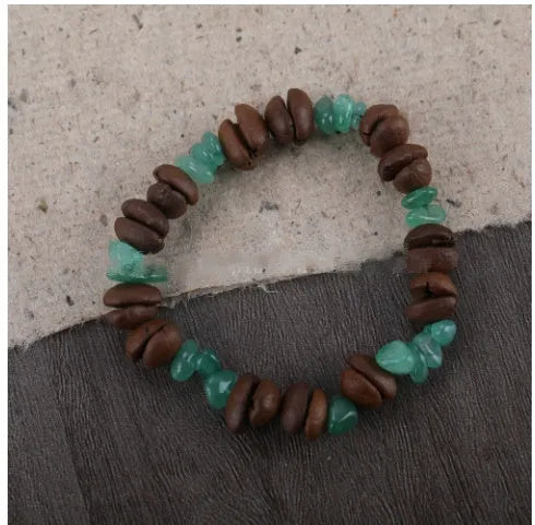 Handmade coffee bean bracelet with 16mm geometric charm showing colour variations