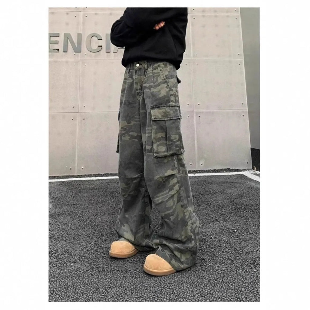 Men's olive and brown washed camouflage cargo trousers with multiple pockets on the thighs and sides.