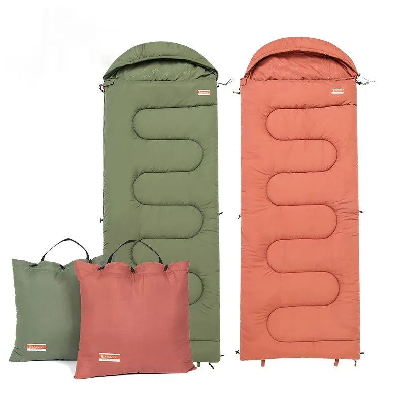 Ultra-light cotton camping sleeping bag quilt shown in ochre and olive green colours, folded for portability.