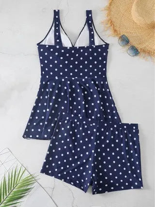Blue polka dot print women's plus size bikini swimsuit top and briefs.