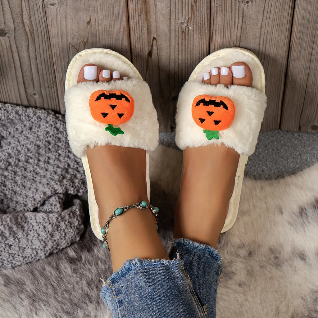 White and yellow cartoon pumpkin plush open-toe slippers with a synthetic fur upper and PVC sole.